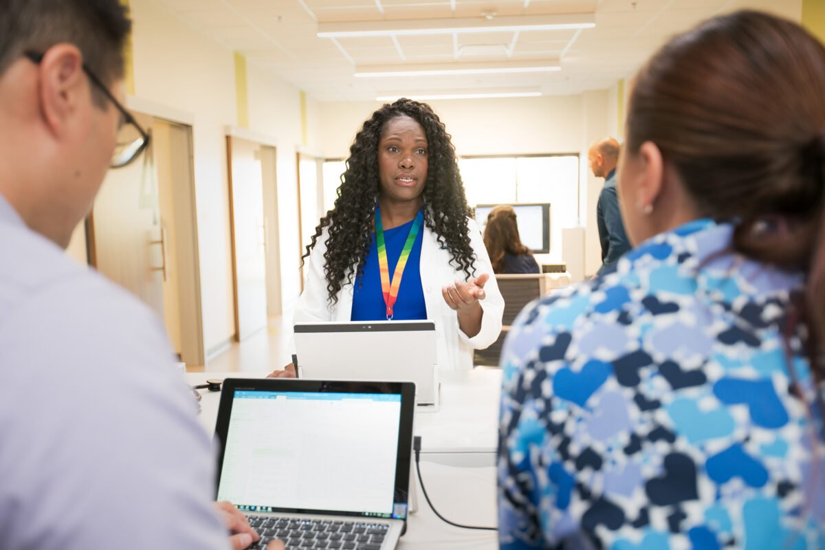 Team members coordinate whole-person care for frequent ED users.