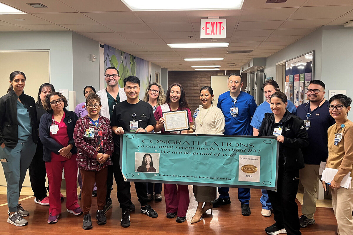 A group of nurse holding a banner for Certified Nurses Day