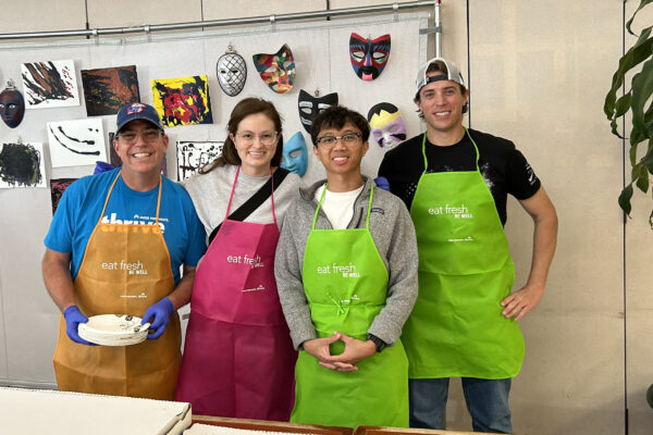 4 Individuals serving Pizza