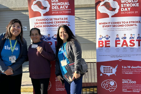 3 nurses in front of stroke awareness banners