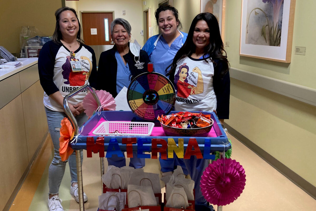 4 nurses with a cart that says Maternal