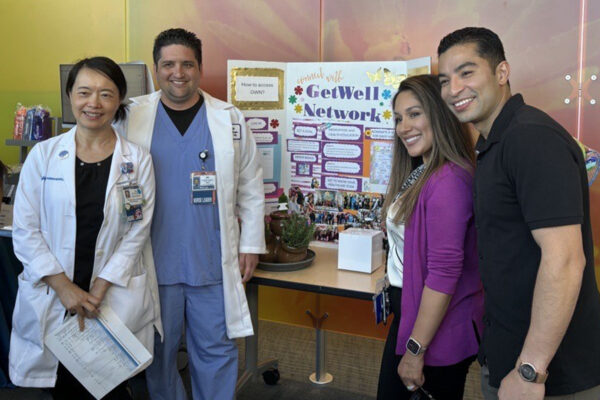 4 nurses around a sign
