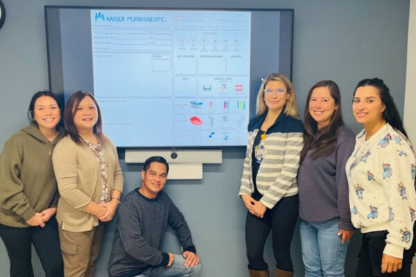 1North nurses next to the care board