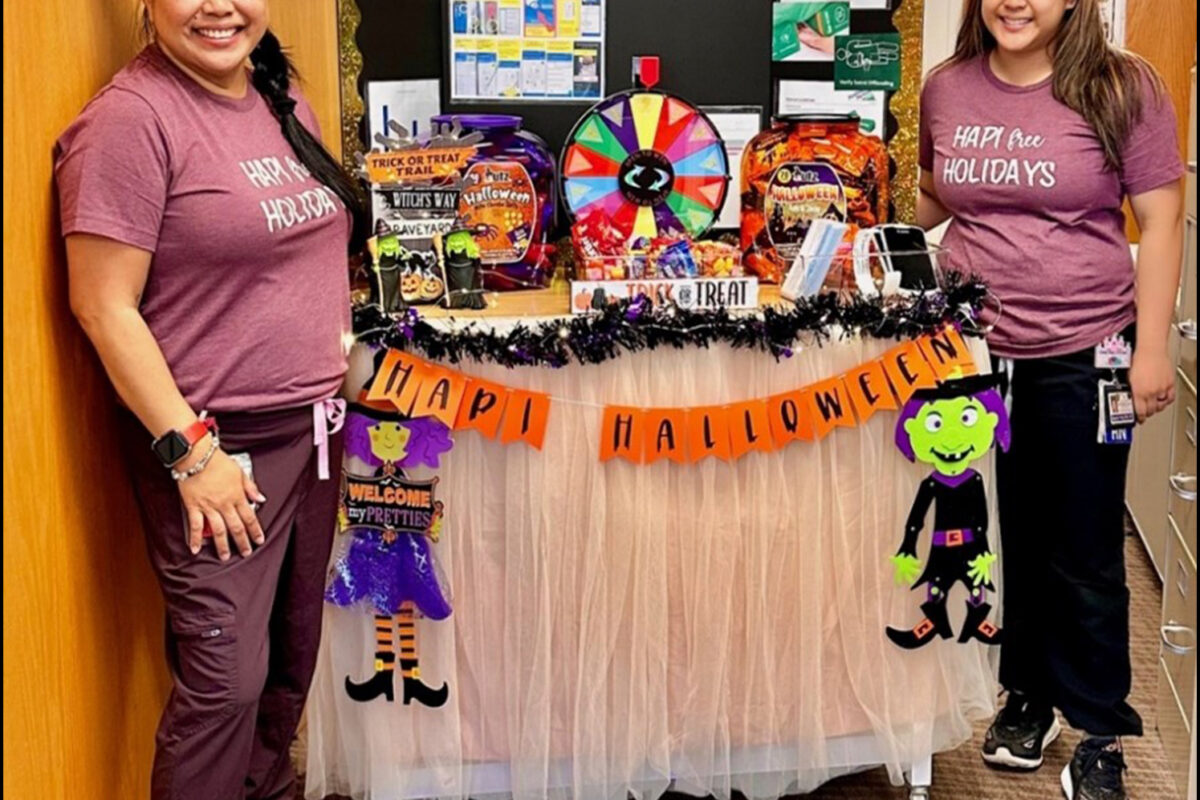 2 nurses at a display for wound care