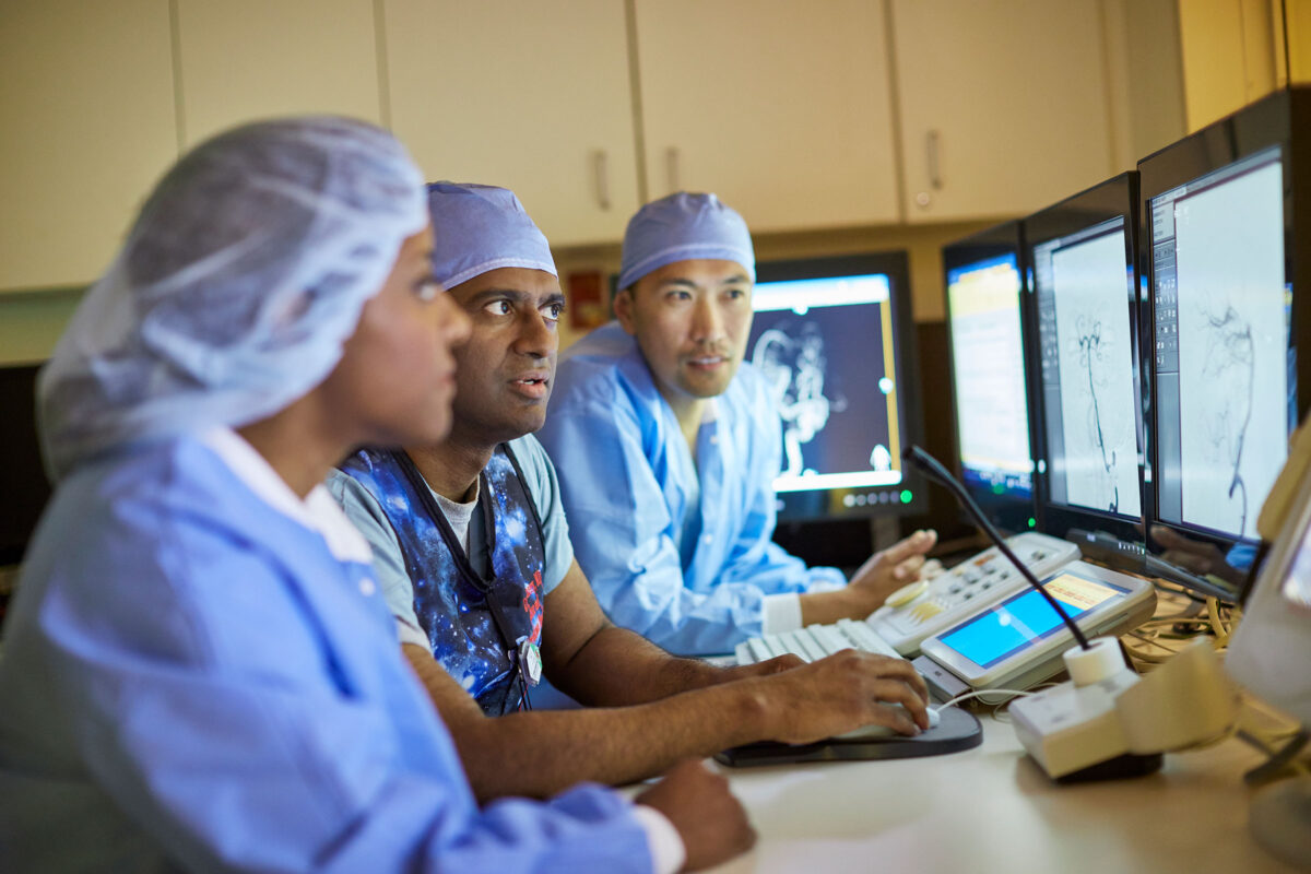 Doctors reviweing Interventional Radiology scans