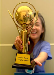 Catherine Hernandez with an award.
