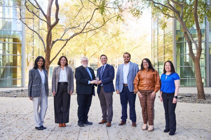 Group of leaders outside smiling