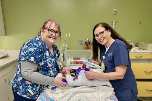 Mary Klingler and Linda Laney with distraction tools