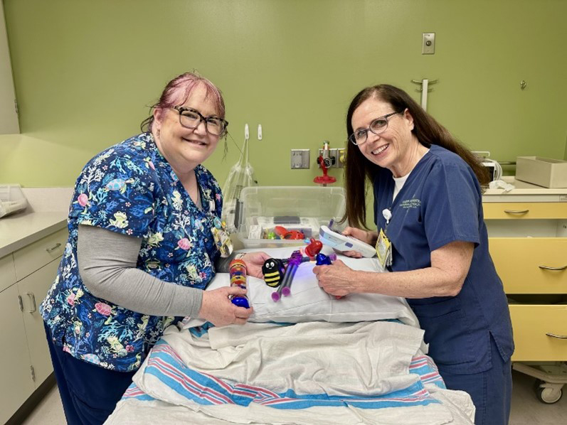 Mary Klingler and Linda Laney with distraction tools