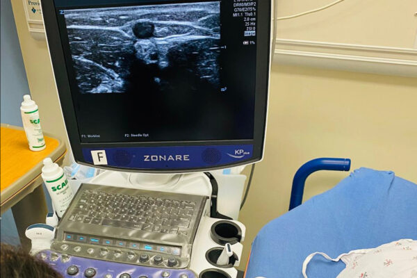 A nurse using ultrasound