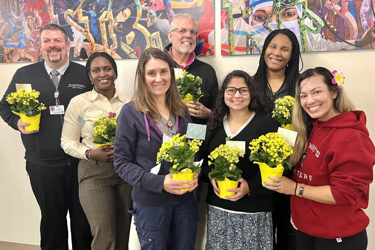A group of nurses with flowers