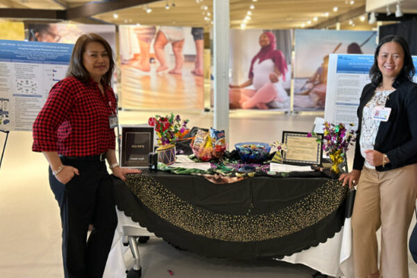 Nurses posing at a table