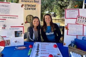 2 nurses at a health fair table