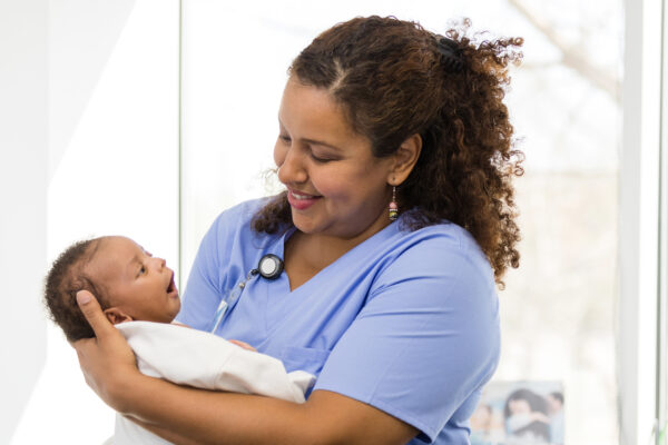 Nurse holding a newborn