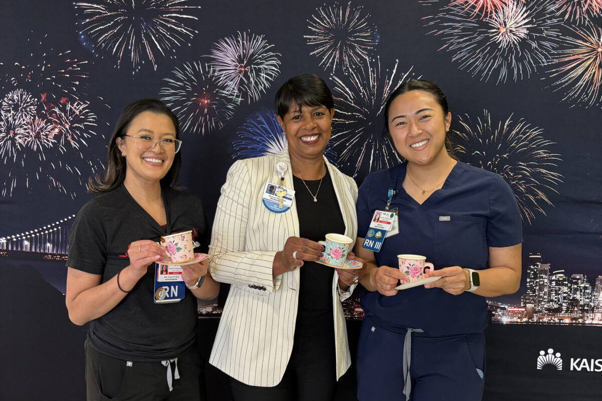 Sharon Hampton with 2 nurses holding tea cups.
