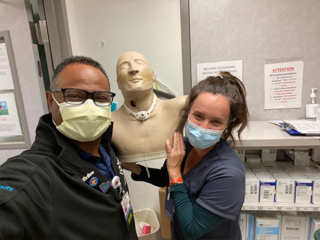 Respiratory Therapist James Shepherd And Assistant Nurse Manager Rebeca Haynes With Todd, A Mannequin Often Used To Help Train Nurses, Patients, And Families.