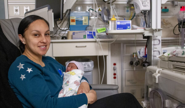Nurse Holding Baby In Vacaville ICU