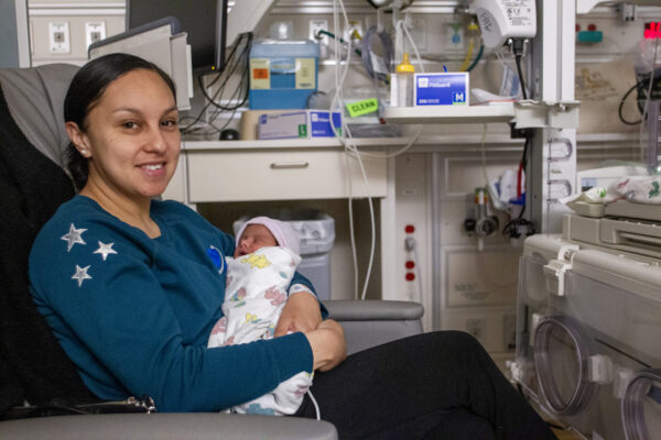 Nurse holding baby in Vacaville ICU