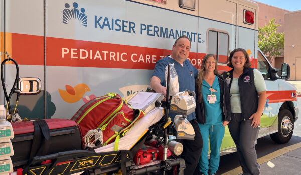 3 Nurses In Front Of An Ambulance.