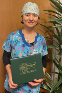 Nurse holding DAISY award