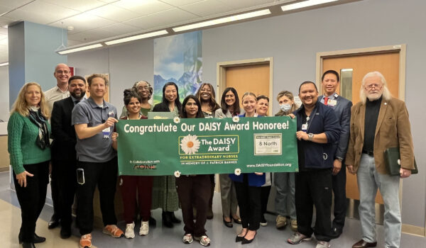 Team Of Nurses With DAISY Award Banner