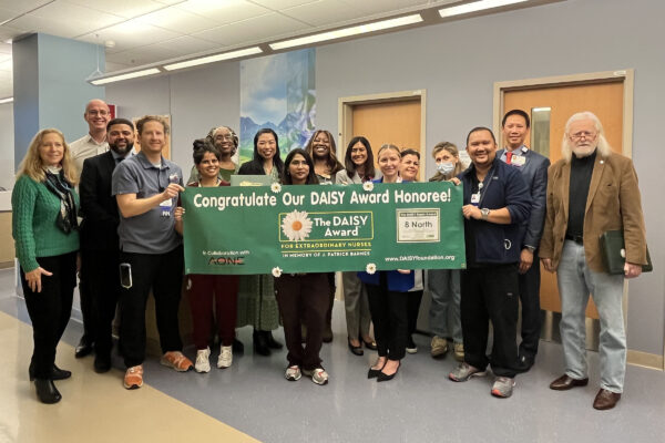 Team of nurses with DAISY award banner