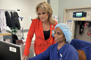 Debbie Reitter and a nurse looking at a computer. 