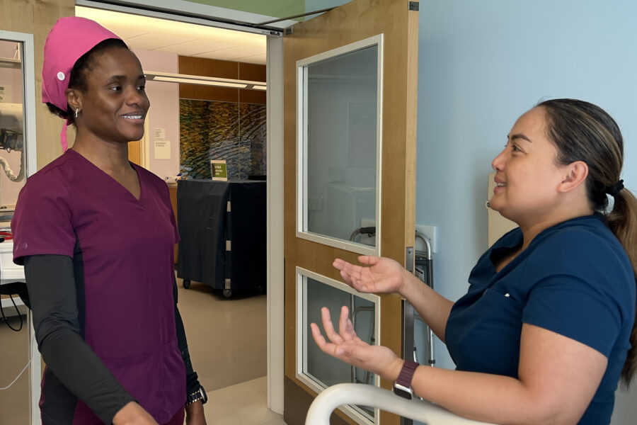 two nurses talking at the bedside