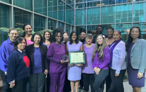A group of Oakland nurses holding their Lotus award.