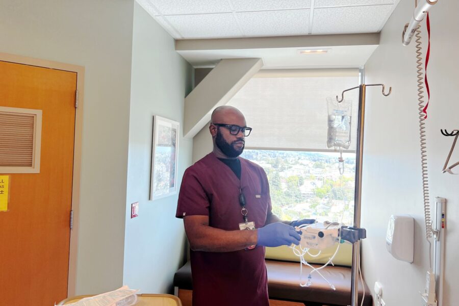A nurse standing in a hospital room