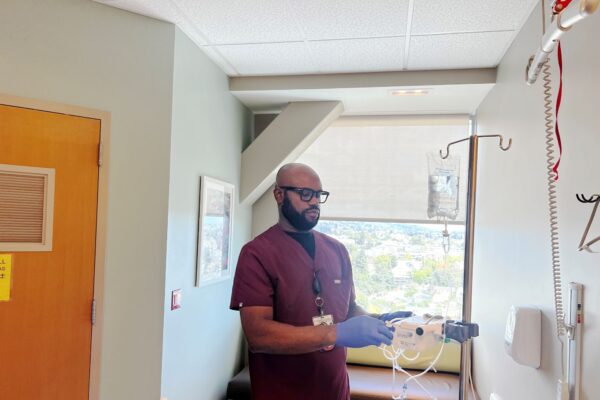 A nurse standing in a hospital room